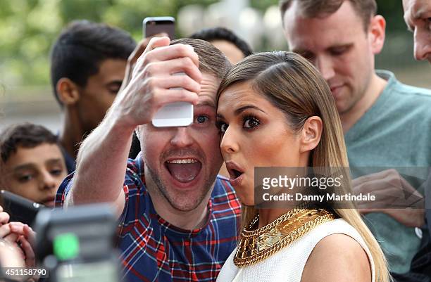 Cheryl Cole pulls a face for a fan as she arrives for the London Auditions of X Factor at Emirates Stadium on June 24, 2014 in London, England.