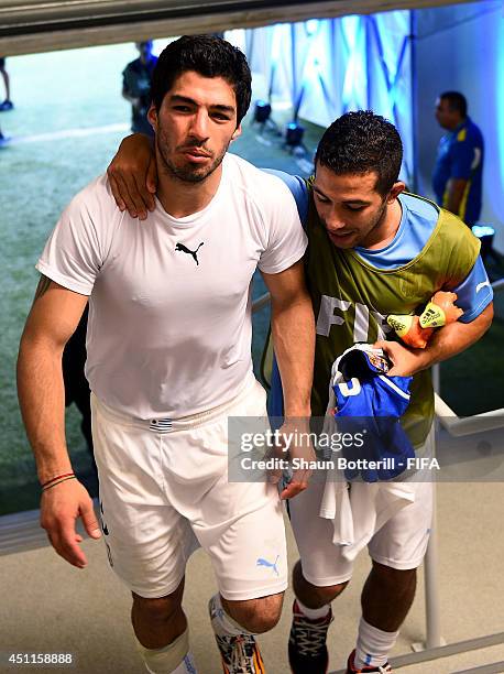 Luis Suarez of Uruguay celebrates the 1-0 win with his teammate Walter Gargano in the tunnel after the 2014 FIFA World Cup Brazil Group D match...