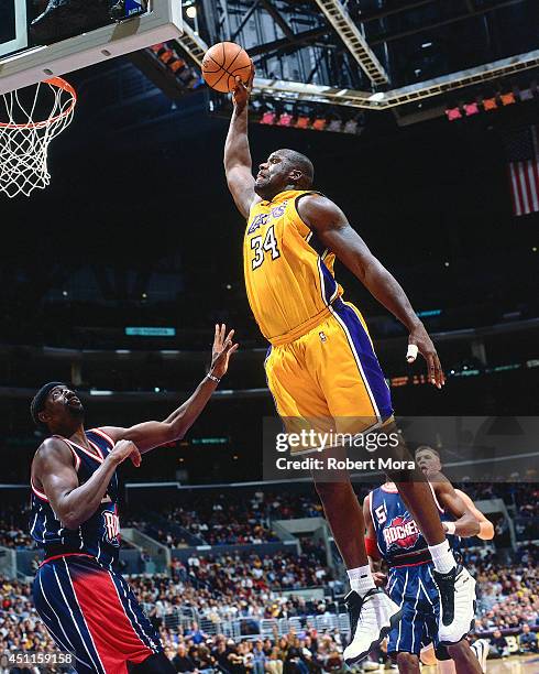 Shaquille O'Neal of the Los Angeles Lakers dunks against the Houston Rockets at the Staples Center on January 19, 2001. NOTE TO USER: User expressly...