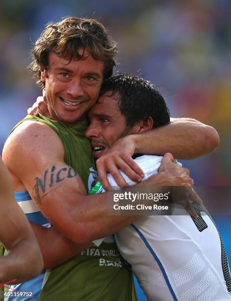 Diego Lugano and Alvaro Gonzalez of Uruguay celebrate a 1-0 victory over Italy in the 2014 FIFA World Cup Brazil Group D match between Italy and...