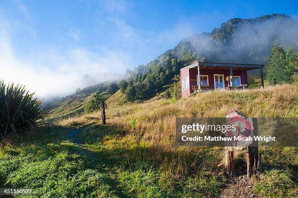 an axe throwing target sits along the road - axe throwing stock pictures, royalty-free photos & images