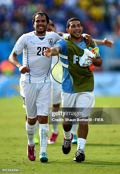 Alvaro Gonzalez and Walter Gargano of Uruguay celebrate the 1-0 win after the 2014 FIFA World Cup Brazil Group D match between Italy and Uruguay at...