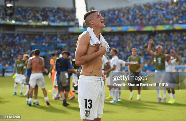 Jose Gimenez of Uruguay celebrates the 1-0 win in the 2014 FIFA World Cup Brazil Group D match between Italy and Uruguay at Estadio das Dunas on June...