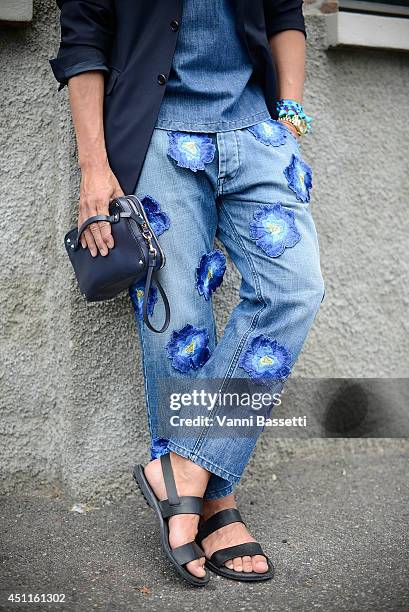 Fashion journalist Simone Marchetti poses wearing a Christian Pellizzari total look, Valentino clutch and Church's sandals before Roberto Cavalli...