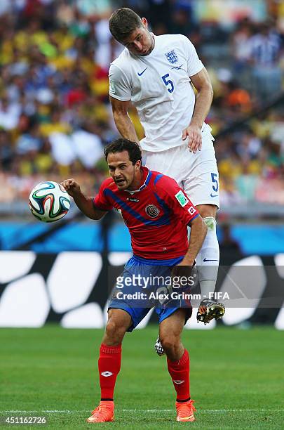 Gary Cahill of England outjumps Marco Urena of Costa Rica during the 2014 FIFA World Cup Brazil Group D match between Costa Rica and England at...