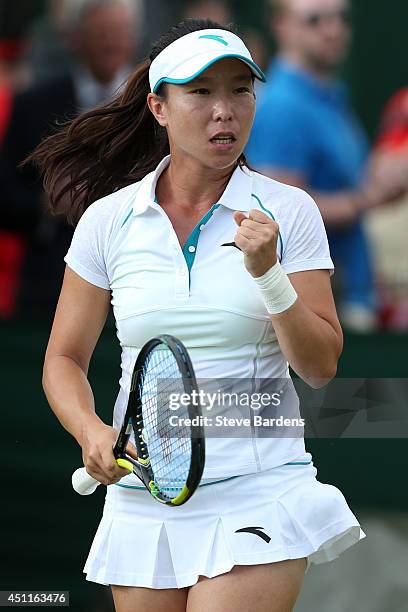 Jie Zheng of China celebrates during her Ladies' Singles first round match against Annika Beck of Germany on day two of the Wimbledon Lawn Tennis...