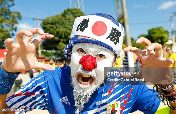 Japanese fan posesfor a picture prior to the Group C match between Colombia and Japan at Arena Pantanal on June 24, 2014 in Cuiaba, Brazil.