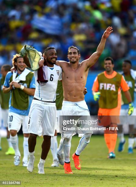 Alvaro Pereira and Martin Caceres of Uruguay celebrate the 1-0 win after the 2014 FIFA World Cup Brazil Group D match between Italy and Uruguay at...
