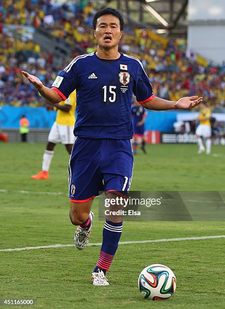 Yasuyuki Konno of Japan reacts during the 2014 FIFA World Cup Brazil Group C match between Japan and Colombia at Arena Pantanal on June 24, 2014 in...