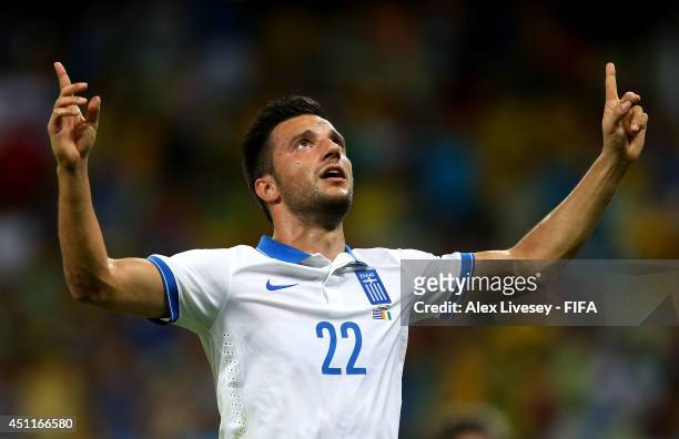 Andreas Samaris of Greece celebrates scoring his team's first goal during the 2014 FIFA World Cup Brazil Group C match between Greece and Cote...