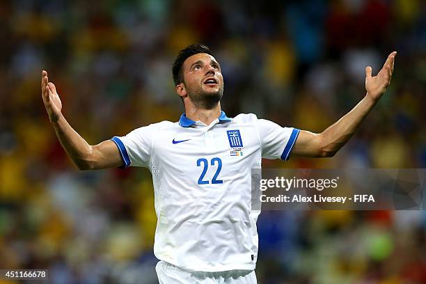 Andreas Samaris of Greece celebrates scoring his team's first goal during the 2014 FIFA World Cup Brazil Group C match between Greece and Cote...