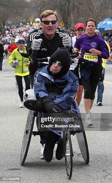 Dick Hoyt pushes his son Rick up Heartbreak Hill section of Commonwealth Ave. In Newton, Mass. April 20, 2009 during the Boston Marathon.