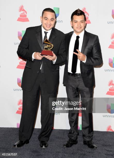 Musicians Felipe Pelaez and Manuel Julian, winners of Best Cumbia/Vallenato Album for "Diferente," pose in the press room at the 14th Annual Latin...