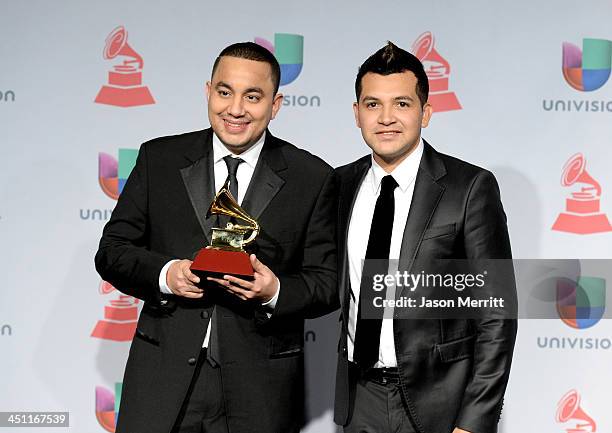 Musicians Felipe Pelaez and Manuel Julian, winners of Best Cumbia/Vallenato Album for "Diferente," pose in the press room at the 14th Annual Latin...