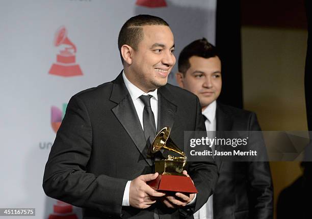 Musicians Felipe Pelaez and Manuel Julian, winners of Best Cumbia/Vallenato Album for "Diferente," pose in the press room at the 14th Annual Latin...