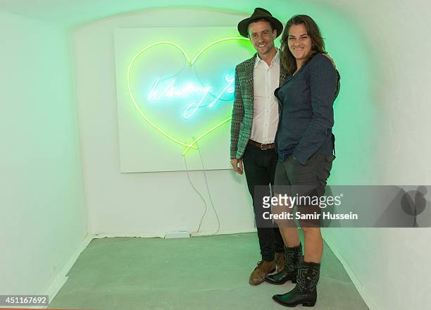 Tracey Enim and Hamish Jenkinson pose at a Private View for 'Illuminating The Future', an online auction with Christie's and £10 e-raffle of a Tracey...