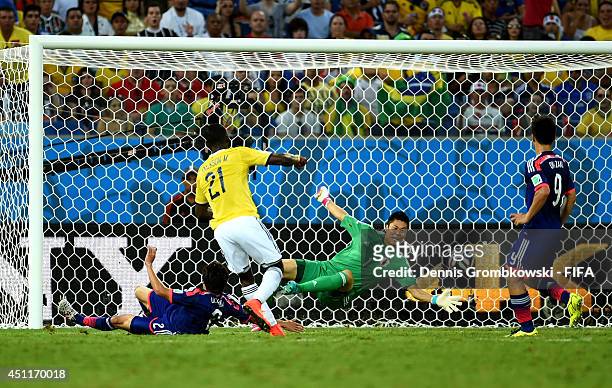 Jackson Martinez of Colombia scores his team's second goal past Eiji Kawashima of Japan during the 2014 FIFA World Cup Brazil Group C match between...