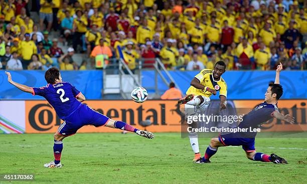 Jackson Martinez of Colombia shoots and scores his team's third goal during the 2014 FIFA World Cup Brazil Group C match between Japan and Colombia...
