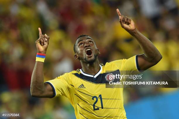 Colombia's forward Jackson Martinez celebrates after scoring his second goal during the Group C football match between Japan and Colombia at the...