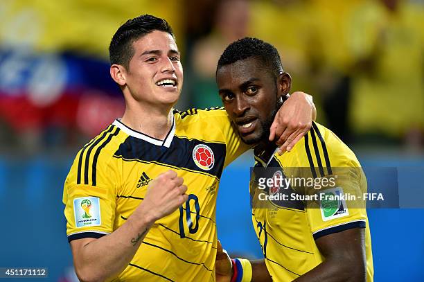Jackson Martinez of Colombia celebrates scoring his team's third goal with his teammate James Rodriguez during the 2014 FIFA World Cup Brazil Group C...