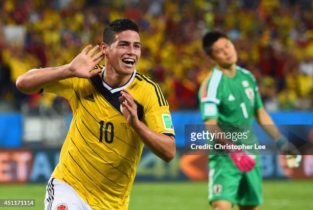 James Rodriguez of Colombia celebrates scoring his team's fourth goal past goalkeeper Eiji Kawashima of Japan during the 2014 FIFA World Cup Brazil...