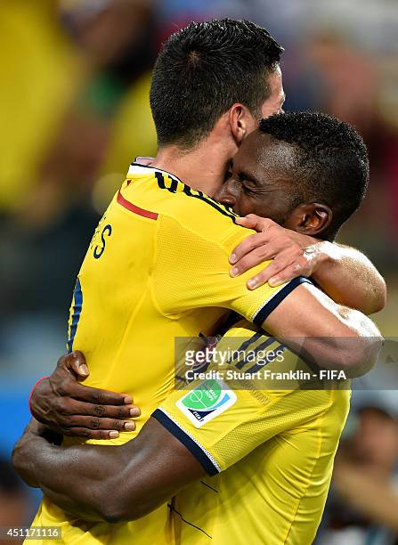 Jackson Martinez of Colombia celebrates scoring his team's third goal with his teammate James Rodriguez during the 2014 FIFA World Cup Brazil Group C...