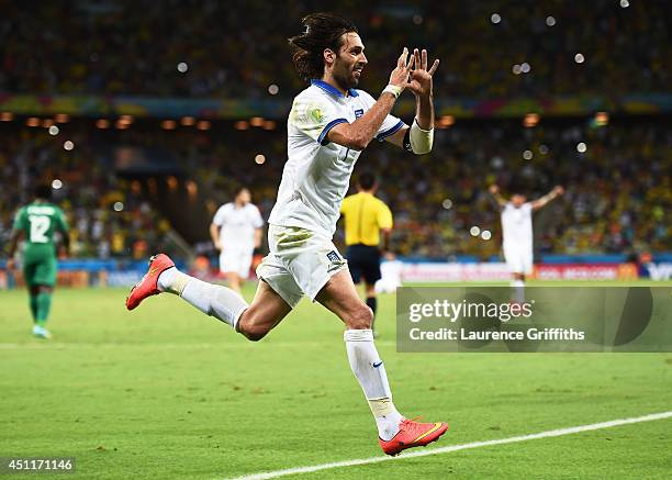 Giorgos Samaras of Greece celebrates scoring his team's second goal on a penalty kick during the 2014 FIFA World Cup Brazil Group C match between...