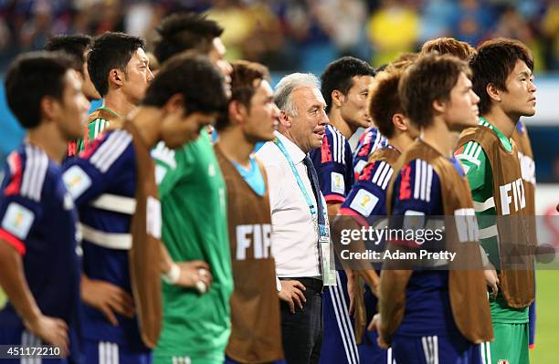 Head coach Alberto Zaccheroni of Japan and his players look on after a 4-1 defeat to Colombia in the 2014 FIFA World Cup Brazil Group C match between...