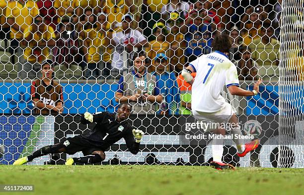 Giorgos Samaras of Greece scores his team's second goal on a penalty kick past Boubacar Barry of the Ivory Coast during the 2014 FIFA World Cup...