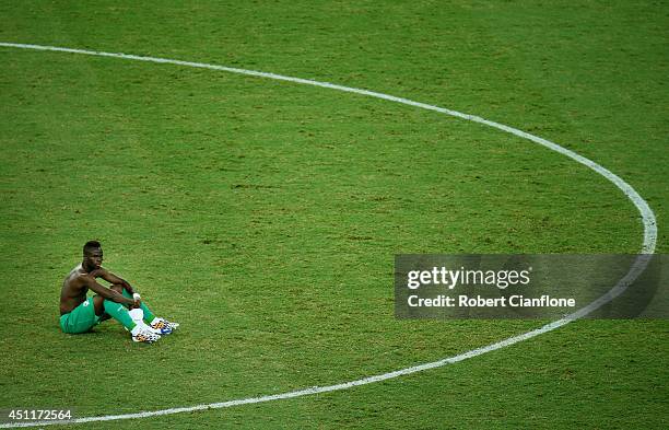 Dejected Ismael Diomande of the Ivory Coast looks on after being defeated by Greece 2-1 during the 2014 FIFA World Cup Brazil Group C match between...