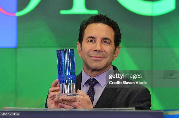 Dr. Paul Nassif, the cast member of 'Botched' rings the closing bell at NASDAQ MarketSite on June 24, 2014 in New York City.