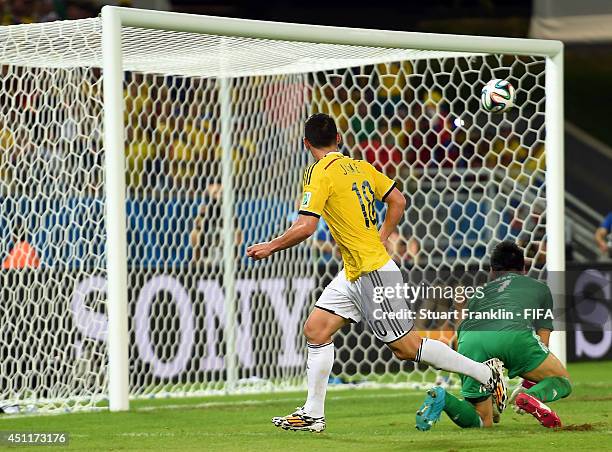 James Rodriguez of Colombia scores his team's fourth goal past Eiji Kawashima of Japan during the 2014 FIFA World Cup Brazil Group C match between...