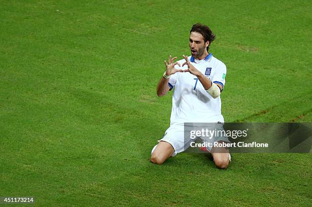 Giorgos Samaras of Greece celebrates scoring his team's second goal on a penalty kick during the 2014 FIFA World Cup Brazil Group C match between...