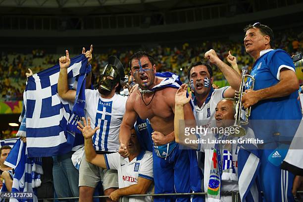 Greece fans celebrate during the 2014 FIFA World Cup Brazil Group C match between Greece and the Ivory Coast at Castelao on June 24, 2014 in...