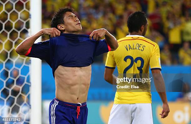 Shinji Kagawa of Japan reacts during the 2014 FIFA World Cup Brazil Group C match between Japan and Colombia at Arena Pantanal on June 24, 2014 in...