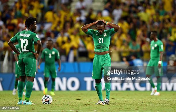 Dejected Wilfried Bony and Giovanni Sio of the Ivory Coast react during the 2014 FIFA World Cup Brazil Group C match between Greece and the Ivory...