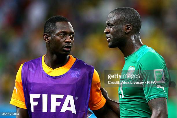Ousmane Diarrassouba and Yaya Toure of the Ivory Coast look on after being defeated by Greece 2-1 during the 2014 FIFA World Cup Brazil Group C match...