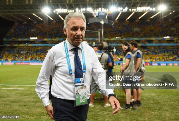 Head coach Alberto Zaccheroni of Japan walks off the pitch after the 1-4 defeat in the 2014 FIFA World Cup Brazil Group C match between Japan and...