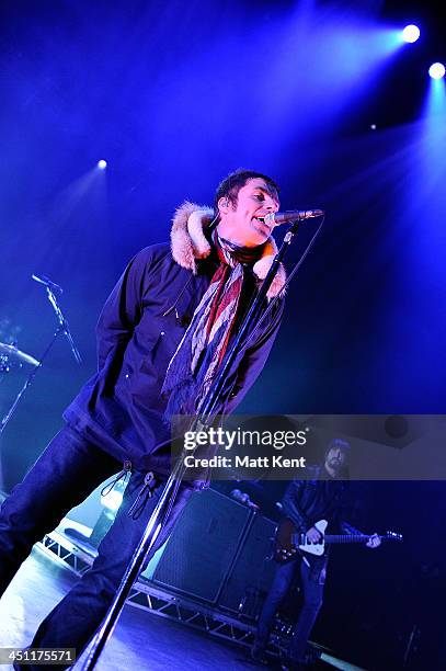 Liam Gallagher and Gem Archer of Beady Eye perform on stage at the Hammersmith Apollo on November 21, 2013 in London, England.