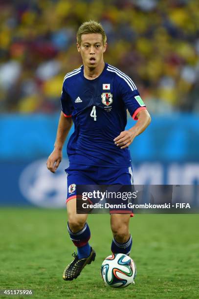 Keisuke Honda of Japan in action during the 2014 FIFA World Cup Brazil Group C match between Japan and Colombia at Arena Pantanal on June 24, 2014 in...