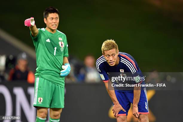 Keisuke Honda of Japan reacts during the 2014 FIFA World Cup Brazil Group C match between Japan and Colombia at Arena Pantanal on June 24, 2014 in...