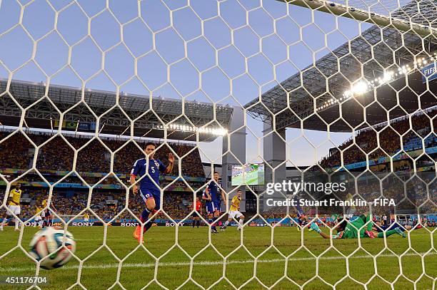 Shinji Okazaki of Japan scores the team's first goal during the 2014 FIFA World Cup Brazil Group C match between Japan and Colombia at Arena Pantanal...