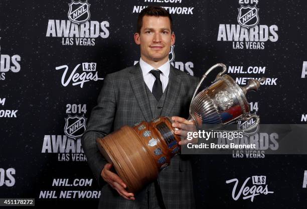 Andrew Ference of the Edmonton Oilers poses with the King Clancy Memorial Trophy during the 2014 NHL Awards at the Encore Theater at Wynn Las Vegas...