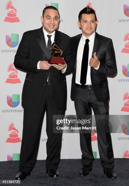 Musicians Felipe Pelaez and Manuel Julian, winners of Best Cumbia/Vallenato Album for "Diferente," pose in the press room at the 14th Annual Latin...