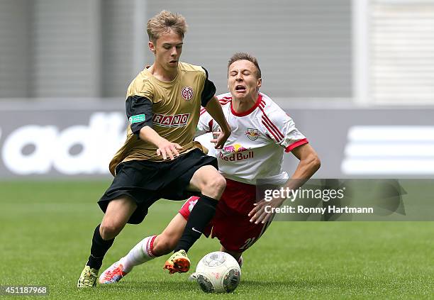 Justin Petermann of Mainz and Dominik Franke of Leipzig compete during the B Juniors Bundesliga semi final second leg match between RasenBallsport...