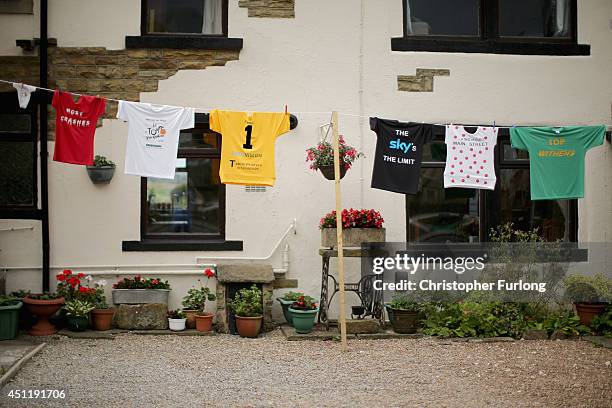 Cycling jerseys hang on the washing line of a cottage on route two as Yorkshire prepares to host the Tour de France Grand Depart, on June 24, 2014 in...