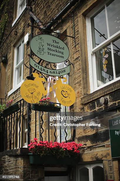 Yellow bicycle hangs from the Wrinkled Stocking Tea Room, the location of Nora Batty's home in the TV hit Last of the Summer Wine as Yorkshire...
