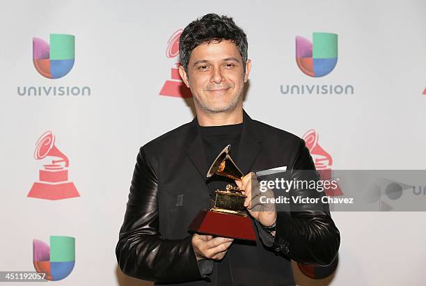 Recording artist Alejandro Sanz, winner of the Best Contemporary Pop Vocal Album for 'La Música No Se Toca,' poses in the press room during The 14th...