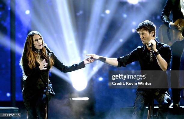 Recording artists Enrique Iglesias and India Martinez perform onstage during The 14th Annual Latin GRAMMY Awards at the Mandalay Bay Events Center on...