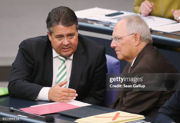 German Vice Chancellor and Economy and Energy Minister Sigmar Gabriel and Finance Minister Wolfgang Schaeuble attend debates at the Bundestag over...